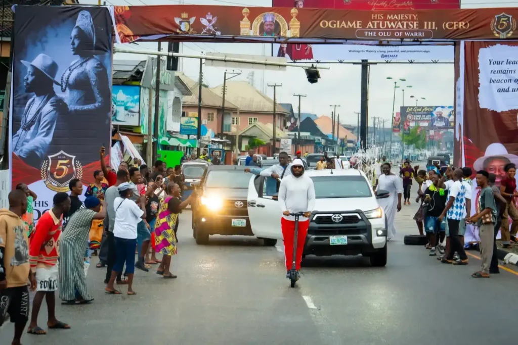 Olu of Warri Rides on Scooter to Inspect 5th Coronation Anniversary Preparations